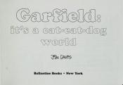 book cover of Garfield, it's a cat-eat-dog world by Jim Davis