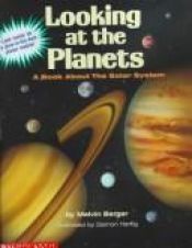 book cover of Looking at the Planets: A Book About the Solar System with a Glow in the Dark Planet Mobile by Melvin Berger